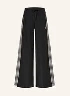 Moda i Uroda OUTLET - Adidas Originals Spodnie Dresowe Firebird Oversized schwarz - miniaturka - grafika 1
