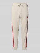 Spodnie sportowe męskie - Spodnie dresowe o kroju regular fit z wyhaftowanym logo - miniaturka - grafika 1