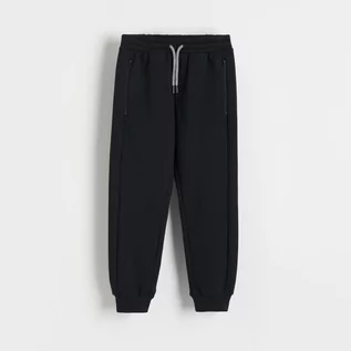Spodnie i spodenki dla chłopców - Reserved - Dresowe joggery z zamkami - Czarny - grafika 1