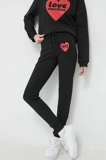 Spodnie damskie - Love Moschino spodnie dresowe kolor czarny z nadrukiem - grafika 1