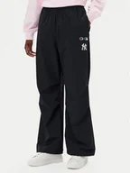 Spodnie sportowe damskie - Champion Spodnie dresowe 117977 Czarny Loose Fit - miniaturka - grafika 1