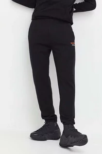 Spodnie męskie - Superdry spodnie dresowe kolor czarny gładkie - grafika 1