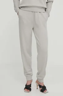 Calvin Klein spodnie dresowe kolor beżowy gładkie - Spodnie damskie - miniaturka - grafika 1