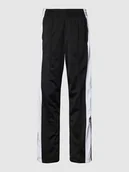 Spodnie sportowe damskie - Spodnie dresowe z bocznymi listwami na zatrzaski model ‘ADIBREAK’ - miniaturka - grafika 1