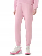 Dresy damskie - Damskie spodnie dresowe 4F TROF1138 56S jasny różowy XXL - miniaturka - grafika 1