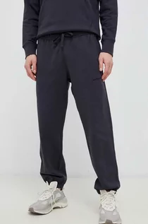 Spodnie męskie - New Balance spodnie dresowe bawełniane kolor szary gładkie - grafika 1