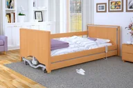 Akcesoria dla osób starszych i niepełnosprawnych - Łóżko rehabilitacyjne regulowane  TAURUS 2 LOW LUX z możliwością obniżenia pozycji leża i z zabudowanymi szczytami RehaBed : Rodzaj leża - Metalowe, Standardowe kolory ramy łóżka - Jasny dąb, Stolik typu Tablet: - Nie, Wysięgnik (max odciążenie 80 kg): - Nie - miniaturka - grafika 1