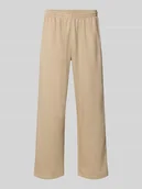 Spodnie sportowe męskie - Spodnie dresowe o kroju wide fit z elastycznym pasem - miniaturka - grafika 1