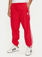 Spodnie sportowe męskie - adidas Spodnie dresowe Adicolor Woven Firebird IT2498 Czerwony Regular Fit - miniaturka - grafika 1