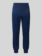Spodnie sportowe męskie - Spodnie dresowe o kroju slim fit z wyhaftowanym logo - miniaturka - grafika 1