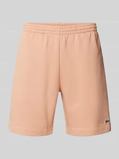 Szorty z dzianiny dresowej o kroju regular fit z elastycznym pasem - Spodnie sportowe męskie - miniaturka - grafika 1