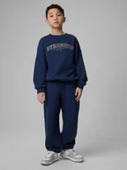 Spodnie i spodenki dla chłopców - 4F Spodnie dresowe z szerokimi nogawkami chłopięce - granatowe 158/164 (12-14 lat) - miniaturka - grafika 1