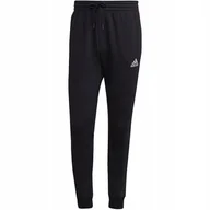 Dresy męskie - Spodnie męskie adidas Essentials Fleece Regular Tapered czarne HL2236 2XL - miniaturka - grafika 1