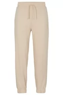 Spodenki męskie - HUGO Męskie spodnie do biegania Dchard Relaxed-Fit z bawełny Terry z logo Stack, Light Beige275, XL - miniaturka - grafika 1