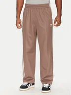Spodnie sportowe męskie - adidas Spodnie dresowe adicolor Firebird JP1067 Beżowy Baggy Fit - miniaturka - grafika 1