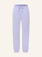 Spodnie damskie - Nike Spodnie Dresowe Oversize Sportswear Phoenix Fleece lila - miniaturka - grafika 1