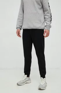 Spodnie męskie - Outhorn spodnie dresowe bawełniane męskie kolor czarny gładkie - grafika 1