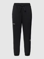 Spodnie sportowe damskie - Spodnie dresowe o kroju relaxed fit z tunelem - miniaturka - grafika 1