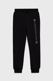 Spodnie damskie - Calvin Klein Jeans Jeans Spodnie dziecięce kolor czarny z nadrukiem - grafika 1