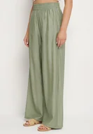 Spodnie damskie - Zielone Spodnie Palazzo o Szerokim Kroju z Gumką w Pasie i Wysokim Stanem Jenanetia - miniaturka - grafika 1