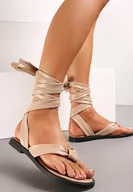 Sandały damskie - Ciemnobeżowe Płaskie Sandały Japonki z Wiązaniem wokół Łydki Dionette - miniaturka - grafika 1