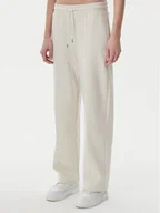 Spodnie sportowe damskie - Puma Spodnie dresowe Ess 629774 Beżowy Straight Fit - miniaturka - grafika 1