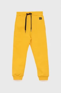 Spodnie i spodenki dla chłopców - Birba&Trybeyond Birba&Trybeyond spodnie bawełniane dziecięce kolor żółty gładkie - grafika 1