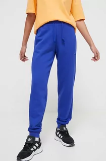 Spodnie damskie - adidas spodnie dresowe kolor niebieski gładkie - grafika 1