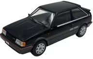 Samochody i pojazdy dla dzieci - Mazda 323 4WD Turbo 1989 model 124222 WhiteBox 1:24 czarny - miniaturka - grafika 1