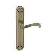 Klamki - Domino Klamka do drzwi wewnętrznych z długim szyldem Casablanka mosiądz/patyna - miniaturka - grafika 1