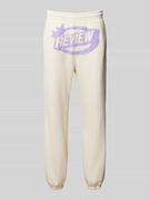 Spodnie sportowe męskie - Spodnie dresowe o kroju regular fit z nadrukiem z logo - miniaturka - grafika 1