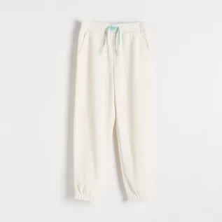 Spodnie i spodenki dla dziewczynek - Reserved - Spodnie ze strukturalnej dzianiny - Kremowy - grafika 1