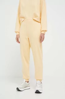 Spodnie damskie - 4F spodnie dresowe kolor żółty gładkie - grafika 1