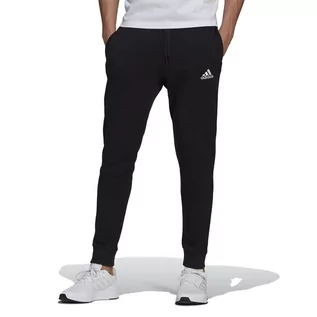 Spodnie sportowe męskie - Spodnie dresowe adidas Essentials Fleece Regular Fit Tapered Cuff GK9268 - czarne - Adidas - grafika 1