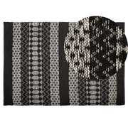 Dywany - Beliani Dywan skórzany 140 x 200 cm czarny z beżowym SOKUN - miniaturka - grafika 1