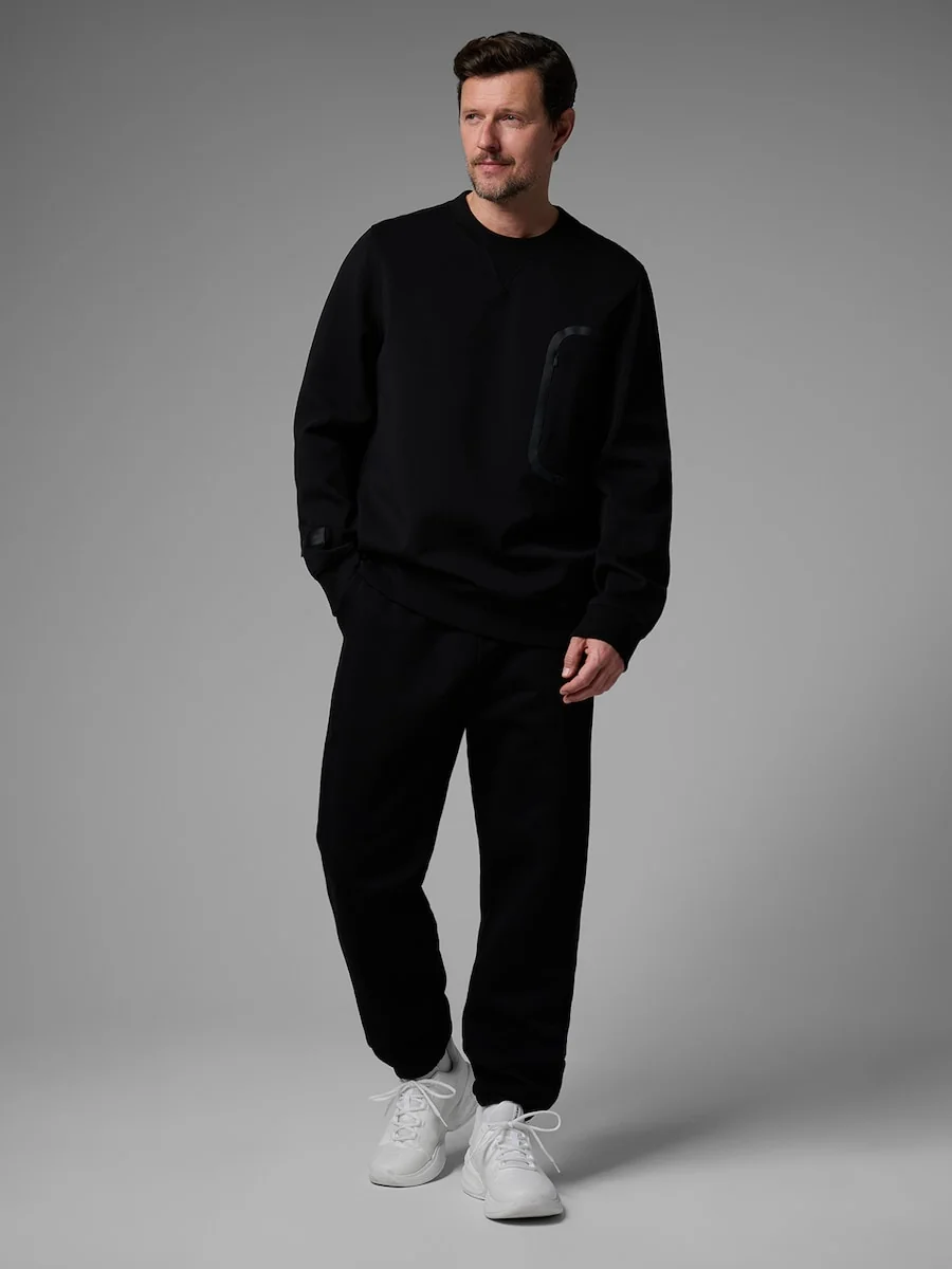 Spodnie dresowe joggery męskie 4F x Robert Lewandowski 4F RL9SAW25TTROM1703-20S Czarny XL