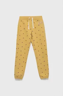 Spodnie i spodenki dla dziewczynek - GAP spodnie dresowe dziecięce kolor żółty wzorzyste - Gap - grafika 1