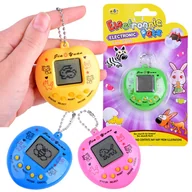 Gry planszowe - Gra elektroniczna TAMAGOCHI tamaguczi GR0212 - miniaturka - grafika 1