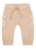 Spodenki dla niemowląt - Noppies Spodnie dresowe "Orion" w kolorze beżowym - miniaturka - grafika 1