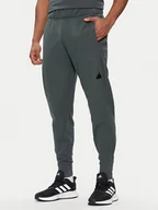 Spodnie sportowe męskie - adidas Spodnie dresowe Z.N.E. Winterized IR5244 Zielony Regular Fit - miniaturka - grafika 1