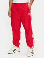 Spodnie sportowe męskie - adidas Spodnie dresowe Adicolor Woven Firebird IT2498 Czerwony Regular Fit - miniaturka - grafika 1
