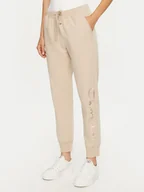 Spodnie sportowe damskie - Champion Spodnie dresowe 117584 Beżowy Slim Fit - miniaturka - grafika 1