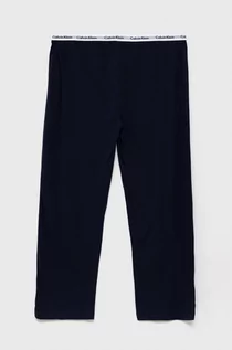 Piżamy damskie - Calvin Klein Underwear Spodnie piżamowe dziecięce kolor granatowy gładka - grafika 1