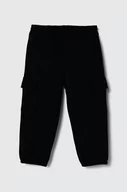 Spodnie i spodenki dla dziewczynek - United Colors of Benetton spodnie dresowe dziecięce kolor czarny gładkie - miniaturka - grafika 1