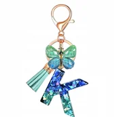 Breloki - Breloczek z literką K i motylem - elegancki dodatek - miniaturka - grafika 1