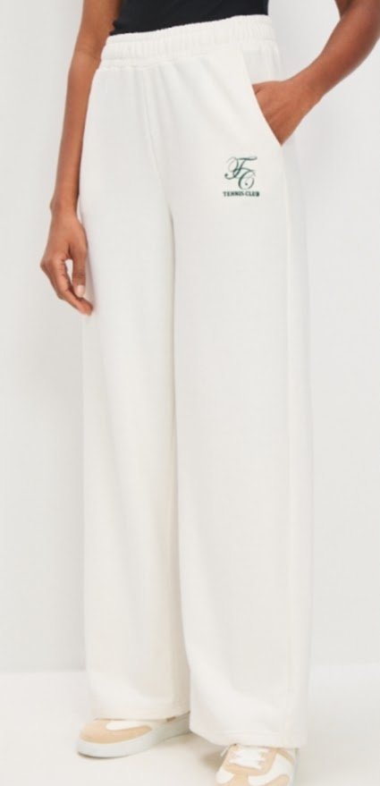 Dresowe damskie spodnie z modnymi szerokimi nogawkami L kremowe