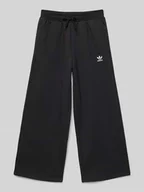 Spodnie i spodenki dla chłopców - Spodnie dresowe o szerokim kroju z wyhaftowanym logo - miniaturka - grafika 1