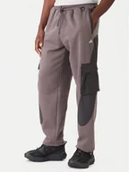 Spodnie sportowe męskie - adidas Spodnie dresowe JV8022 Brązowy Regular Fit - miniaturka - grafika 1