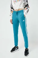 Spodnie damskie - adidas spodnie dresowe kolor turkusowy z aplikacją - miniaturka - grafika 1