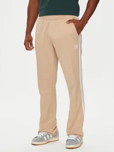 adidas Spodnie dresowe adicolor 70's IX5221 Beżowy Regular Fit - Spodnie sportowe męskie - miniaturka - grafika 1